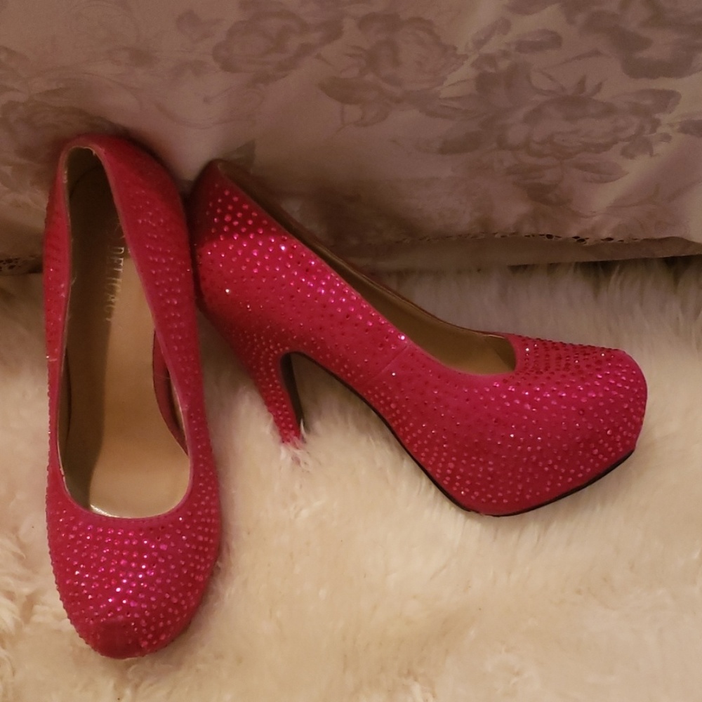 Pink bejeweled pumps